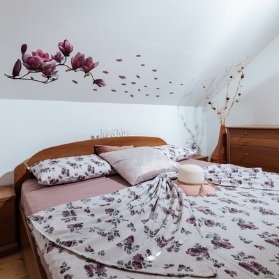 The attic features a bedroom with a double bed.