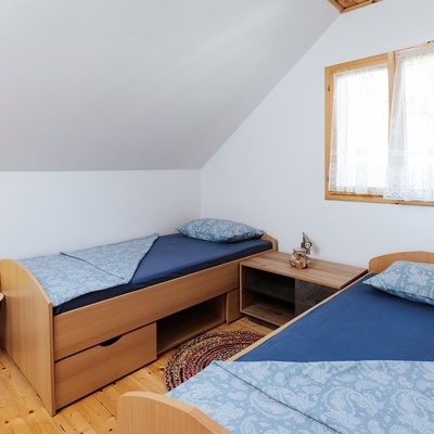 There are two bedrooms in the attic; one of them has two separate beds.