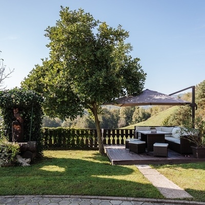 The well-kept yard offers space for relaxation and socializing.