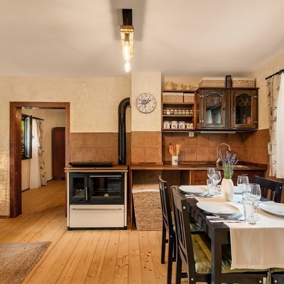 The rooms are bright and furnished in a rustic style.